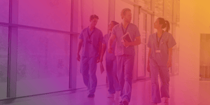 Healthcare workers walking corridor