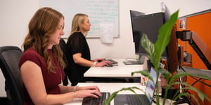 women in technology working in corporate office with plants 